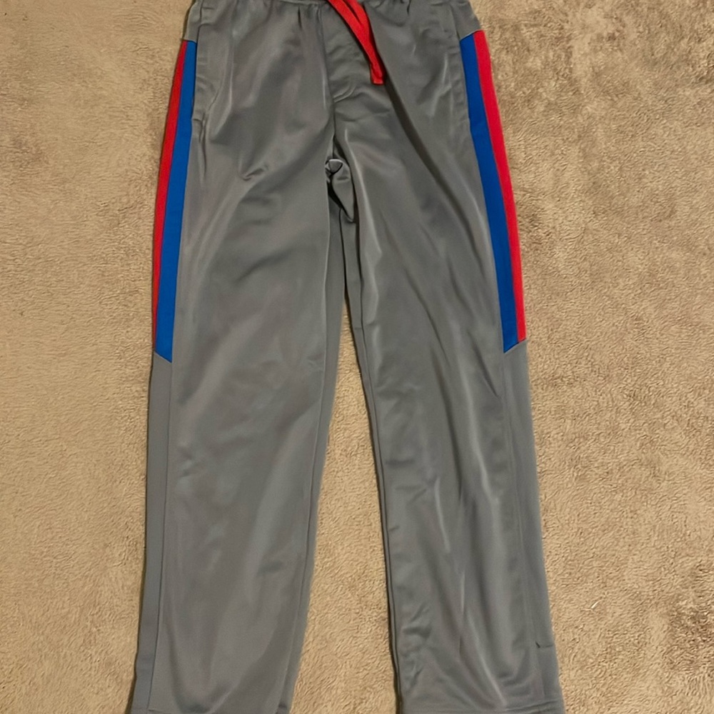 Cool, looking red blue and gray athletic works pants.
